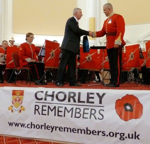 Presentation by Lindsay Hoyle MP to Bandmaster Craig Philbin