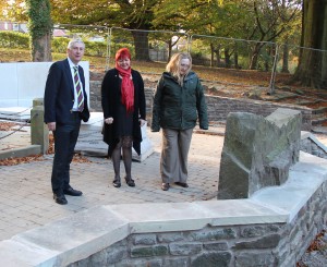 Lindsay Hoyle MP with Claire Wade and Jane Anderson look at the relocated conflict stones.